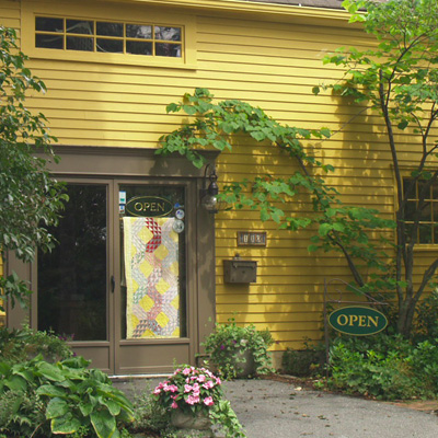 An inviting picture of Rocky Mountain Quilt's front door